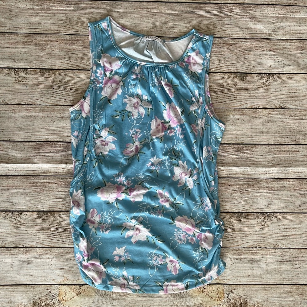 Very gently used. Blue floral Women's Nursing Top. Size small.